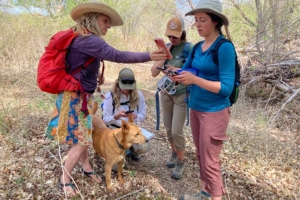 community scientists with a dog
