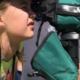 young birder looking through scope