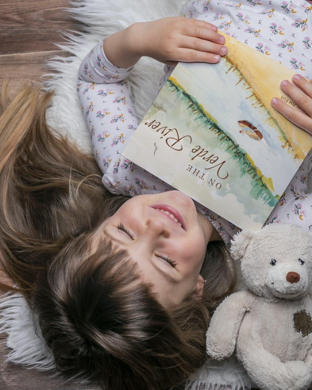 On the Verde River child holding book (1)
