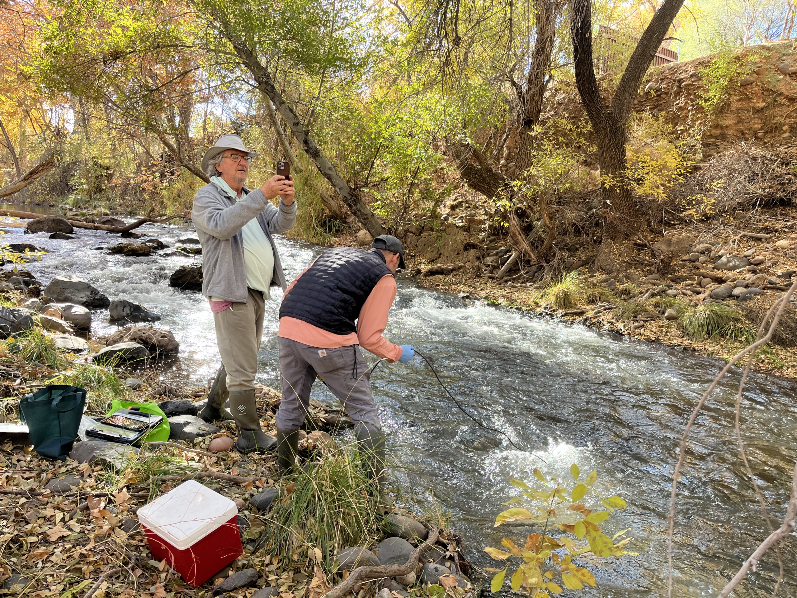 Two water quality volunteers testing the river